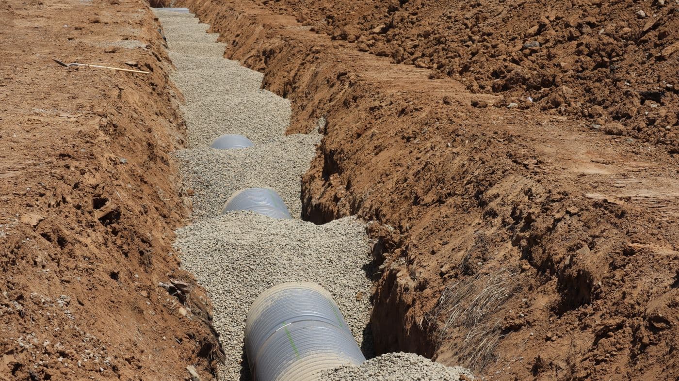 Drainage pipe installed in an excavated trench