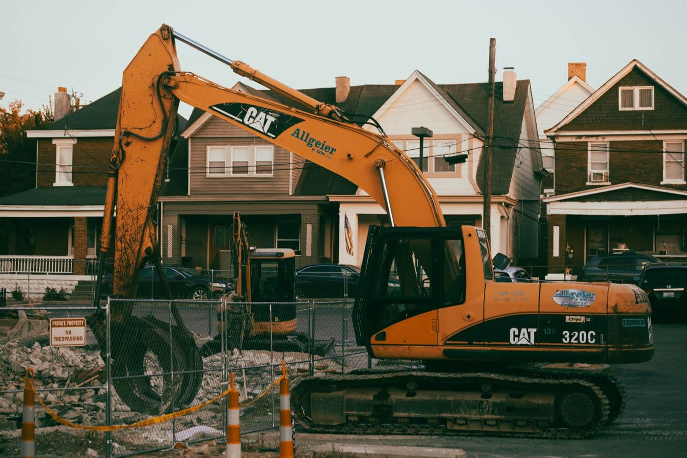 Excavator grading a residential property